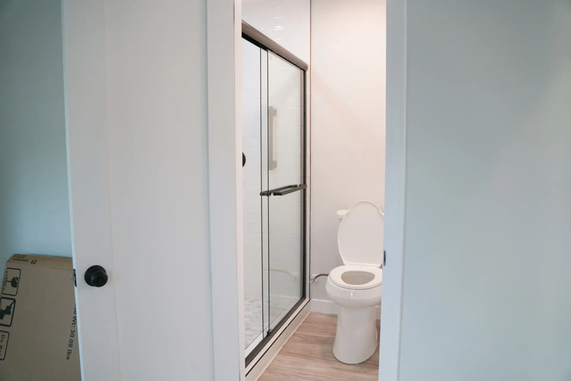 Finished bathroom with glass shower enclosure